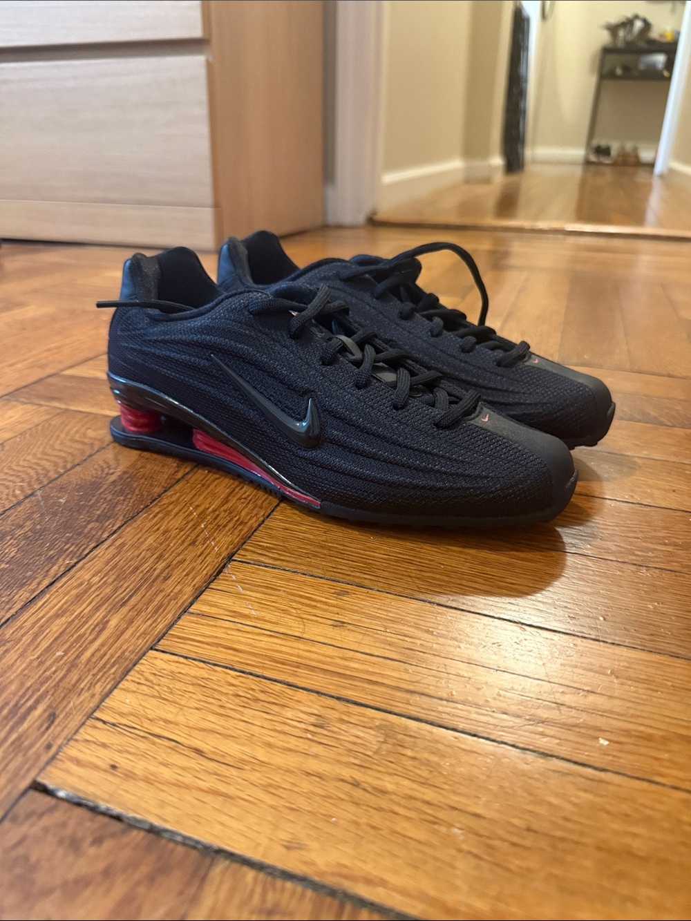 Nike Women’s Shox Black Sneakers with Red Air Accent